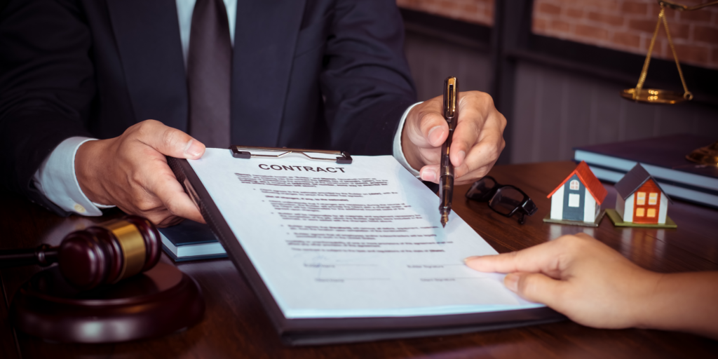 Attorney reviewing a contract with a client